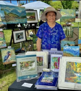 Artist with paintings